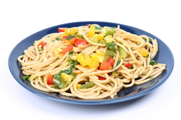 Spaghetti with vegetables on a plate on white background