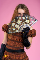 Cute young woman with fan