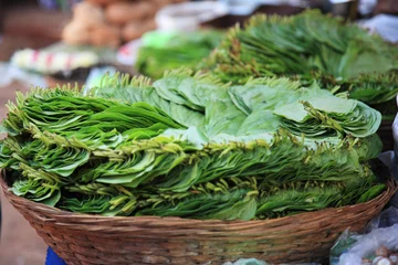 Foto op Plexiglas Green leaves in a basket India © Deborah Benbrook