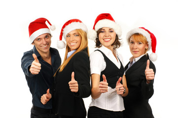 Four young and smart business persons in Christmas hats