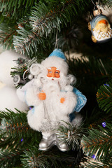 Christmas toys on green fir