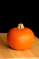 Pumpkin on wood tabletop