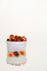 candy corn in white bowl on white