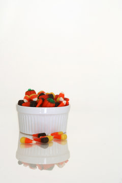 Candy Corn In White Bowl On White