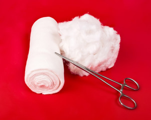 bandage with a surgical instrument and the wool