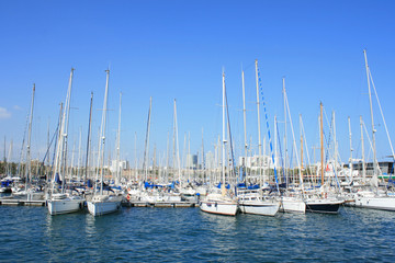 Fototapeta na wymiar Yachts at Port Vell in Barcelona.