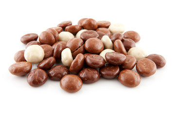 pile of chocolate gingernuts, pepernoten over white background