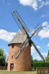 Fototapeta na wymiar Old renovated windmill