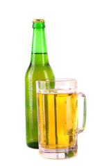 Bottle of beer and cup isolated on white