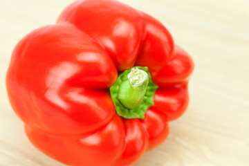 red pepper on a cutting board isolated on white