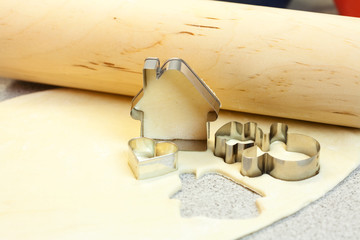 forms for the cookies, rolling pin and dough