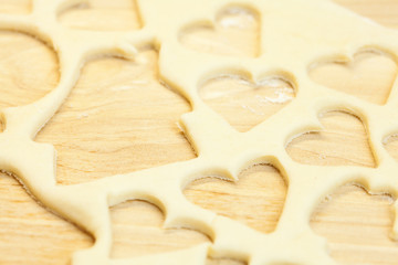 cut in the dough snowman, heart, and  house