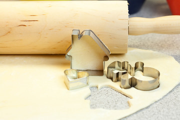 forms for the cookies, rolling pin and dough