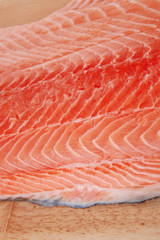fresh uncooked red fish fillet on wood