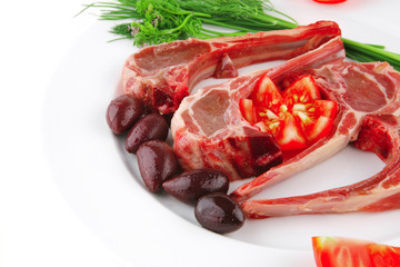 uncooked ribs on white