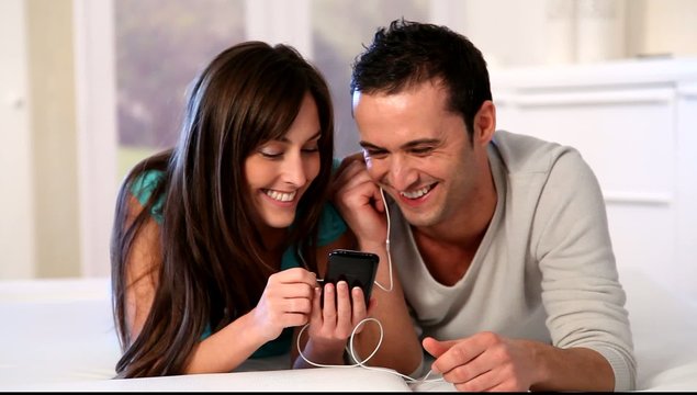 Young couple listening to music