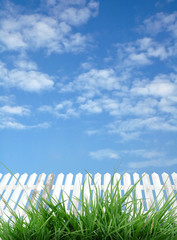 white fence with blue sky