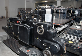 Old print finishing machine in printshop