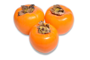 Three ripe persimmons