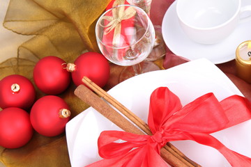 Christmas setting,cinnamon sticks, ribbon,christmas balls