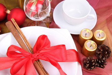 Christmas setting,cinnamon sticks, ribbon,christmas balls