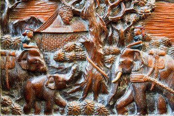 farmer and elephant wood carving background