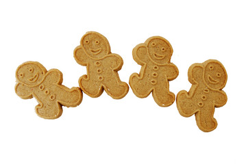 four gingerbread men on white