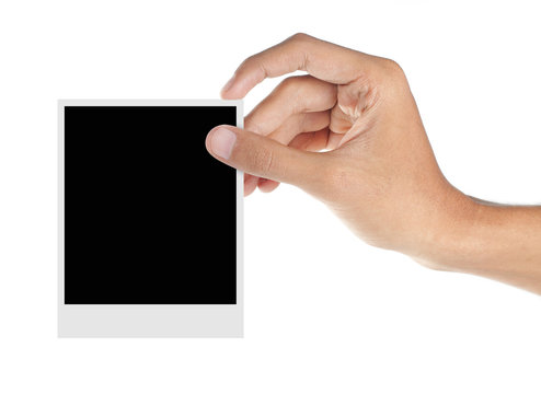 hand holding a blank photo frame