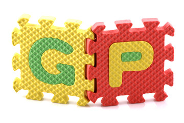 Alphabet puzzle pieces on white background