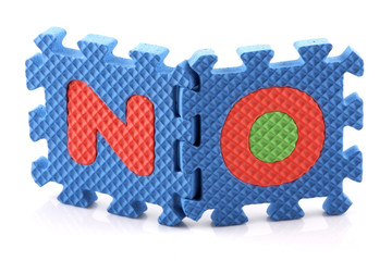 Alphabet puzzle pieces on white background