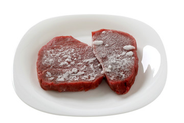 frozen meat on an white plate