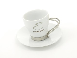Espresso coffeé cup, on plate, towards white