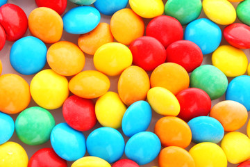 background of multicolored candy coated chocolate sweets