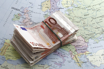 euro bills and map