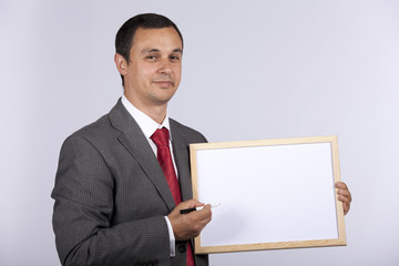 businessman holding a whiteboard