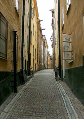 Fototapeta na wymiar Cobblestone street with bicycles in Stockholm, Sweden