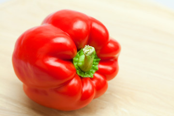 red pepper on a cutting board isolated on white