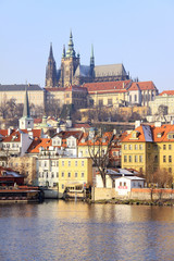 Fototapeta na wymiar First Snow in Prague, gothic Castle above the River Vltava