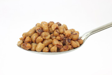 Black eyed peas on large serving spoon