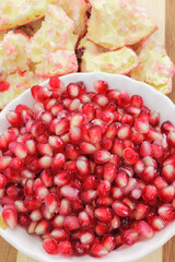 Close view of pomegranate seeds and peelings