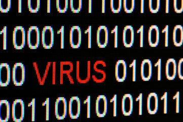 Closeup of binary code infected by computer virus.