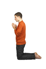 a man praying on his knees