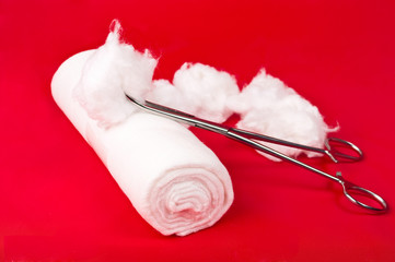 bandage with a surgical instrument and the wool
