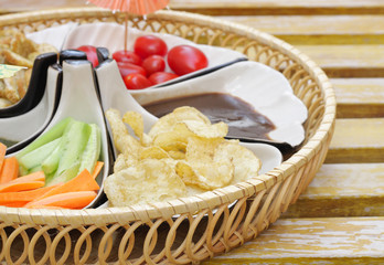Delicious appetizer with salad, bread and chips with sauce