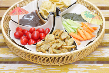 Cherry tomato, shortbread, salad and chips with sauce