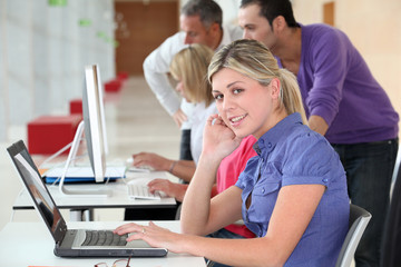 Young blond woman in business training