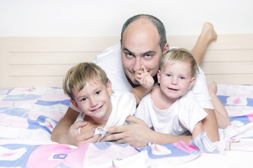 father and two children at home