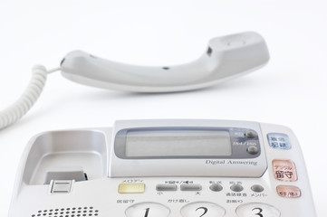 Fototapeta premium 受話器をとった電話機