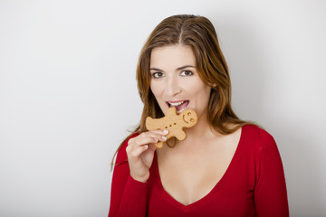 Bitting a Gingerbread cookie