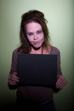 Frustrated Woman Taking Mugshot